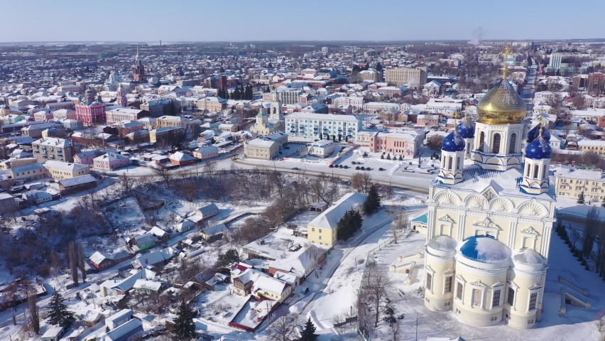 Scenic aerial view of main Orthodox church in Russian city of Yelets, five domed Ascension Cathedral on sunny winter day Royalty-Free Stock Footage #1091434549