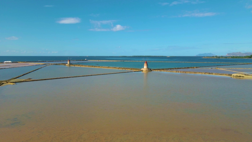 Trapani windmills, Natural reserve of the Saline dello Stagnone, near Marsala and Trapani, Sicily., Aerial picture of Trapani salt evaporation ponds and salt mounds windmill 