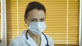 Therapist fight in quarantine. A stressfull doctor in white uniform fight against coronavirus spread in the room. - Powered by Shutterstock - Get 15% off with code: PIKWIZARD15