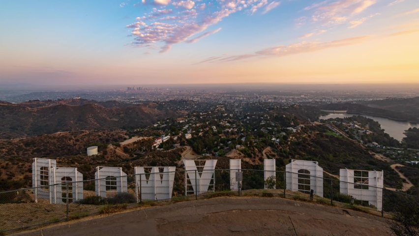 LOS ANGELES, CANIFORNIA, USA - APRIL 2, 2021: Hollywood sign with city skyline timelapse from sunset to evening