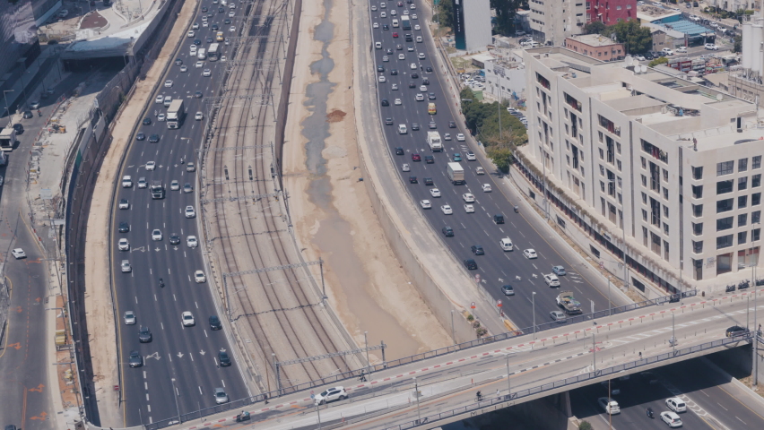 Tel Aviv , Israel - June 2022: Tel Aviv Cityscape And Ayalon Highway Aerial View At Day, Israel - Tilt Down