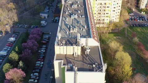 Aerial view of a ventilation system with many ventilation ducts and air conditioners in a multi-storey building