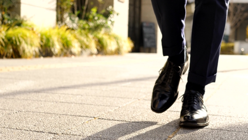 The feet and back of a young Japanese businessman | Shutterstock HD Video #1091458999