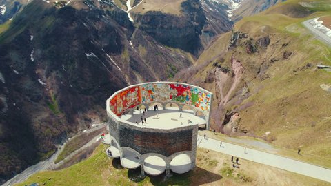 18.05.2022. Gudauri, Georgia. top-down view of the famous Friendship monument in the Caucasus mountains. High quality 4k footage