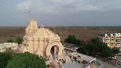 Palitana , Gujarat , India - 06 14 2022: Aerial rotating shot of Palitana temple. The Palitana temples of Jainism are located on Shatrunjaya hill by the city of Palitana in Bhavnagar district, Gujarat