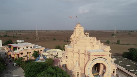 Palitana , Gujarat , India - 06 14 2022: Aerial Panning shot of left to right of Palitana temple in Gujrat ,India. The Palitana temples of Jainism are located on Shatrunjaya hill by the city of Palita