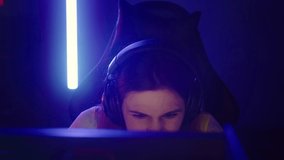 Girl Faces Challenge During Professional Video Game Tournament At Cyber Arena. Girl Thinks Over Her Next Move In Game Tournament Challenge. Gamer Girl Focused On Online Tournament Challenge