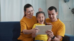 Happy family chatting online. Modern technologies for online school education. Family communicates with doctor.Online communication.Modern technologies of consultation with doctor and school education
