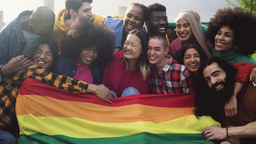 Happy diverse young friends celebrating gay pride festival - LGBTQ community concept  Royalty-Free Stock Footage #1091475953