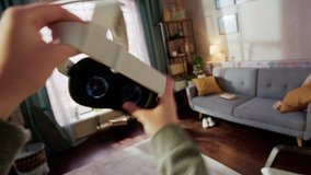 POV of a Person Picking Up and Putting On Virtual Reality Headset in Living Room at Home. Mock Up for Inserting Your Own VFX Virtual Reality 3D Universe, Digital Office Interface, Social Platform. - Powered by Shutterstock - Get 15% off with code: PIKWIZARD15
