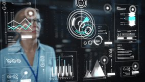 Adult Female Engineer Using Futuristic Augmented Reality Software Interface for Managing Data Center Work Projects. Specialist Researching Performance Data Graphs with Different Parameters. - Powered by Shutterstock - Get 15% off with code: PIKWIZARD15