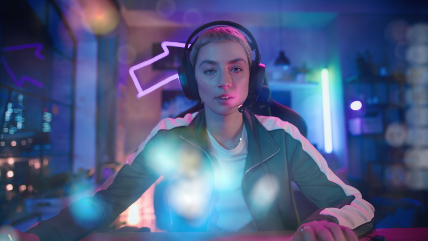 Gaming at Home: POV from Screen Perspective with Animated Online Video Game in Foreground. Female Gamer in Headphones and Playing Strategy on Computer in Loft Apartment. Zoom Out Shot. Royalty-Free Stock Footage #1091478391