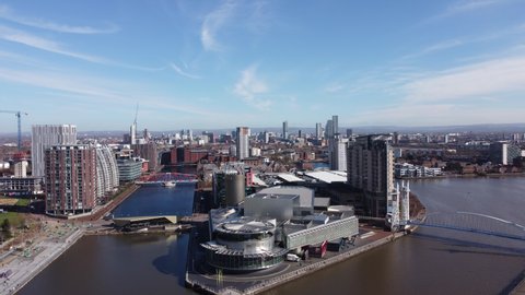 Salford Quays England. June 1, 2022. Aerial footage of modern buildings with views towards Manchester City centre. 