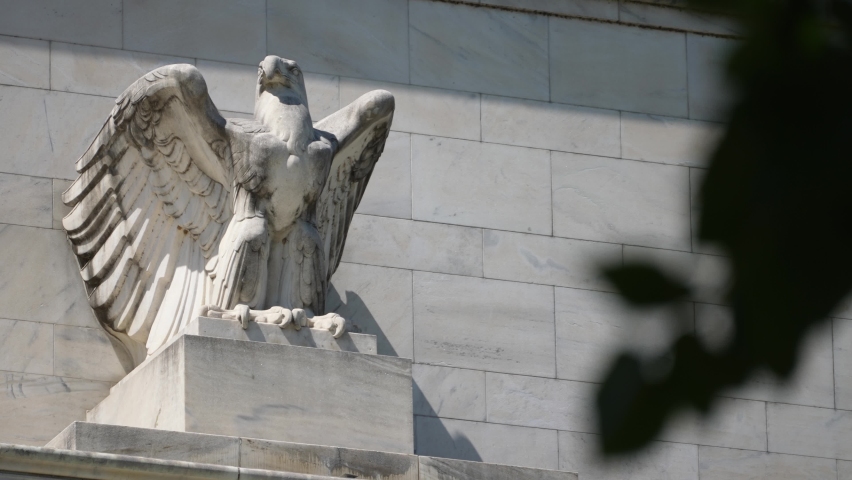 Closeup of the eagle on top of the federal reserve government Eccles building in Washington, DC where inflation financial policy is made. Royalty-Free Stock Footage #1091482869