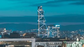 Tbilisi, Georgia. Hith tower building above Urban Cityscape during evening night lights. Elevated view Tbilisi skyline Time timelapse. night video.