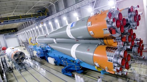 Plesetsk kosmodrom, Mirny, Russian Federation. 11.17.2021: Assembly Proton-M launch vehicle indoors at technical facility. Space tech of build rocket with payload propulsion. 