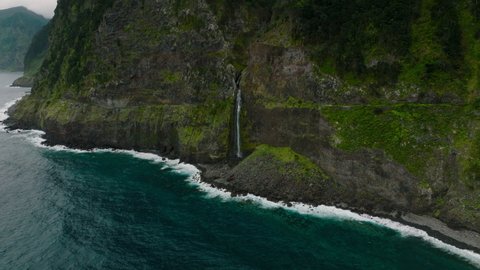 Veu da Noiva waterfall cascading into Atlantic ocean; Seixal, Madeira