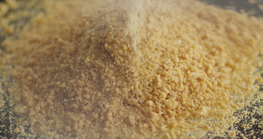 Breadcrumbs fall on a mountain of breadcrumbs Royalty-Free Stock Footage #1091497659