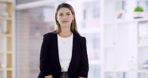 Confidence is just one of my many strengths. 4k video footage of a well dressed corporate businesswoman standing with her arms folded in the office.