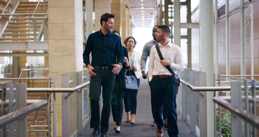Walking in, ready for business. 4k video footage of a group of businesspeople walking through their office building. | Shutterstock HD Video #1091505669