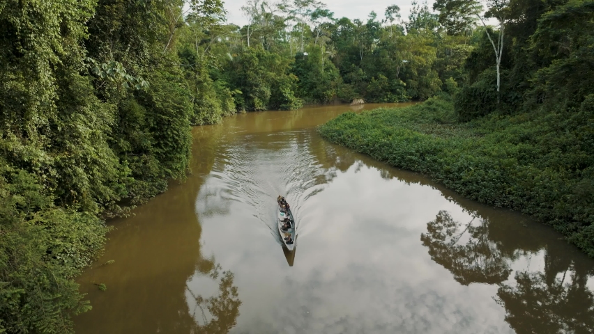 Traditional Boat In Amazon River Amidst Dense Vegetation In Ecuador. Aerial Drone Ascending Royalty-Free Stock Footage #1091517503