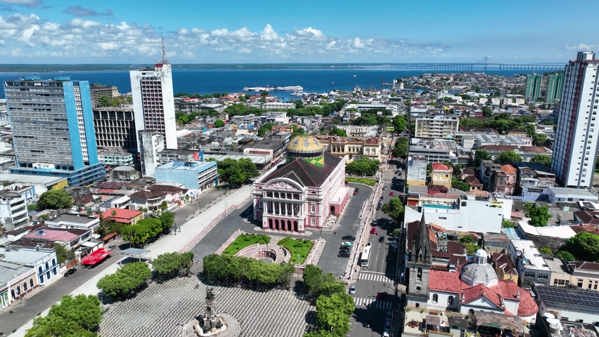 Panorama aerial view of Amazonas Theater at downtown city Manaus Brazil. Cityscape of tourism landmark city. Amazonas medieval building theater at downtown Manaus Brazil. Amazonas Theater building. Royalty-Free Stock Footage #1091524387