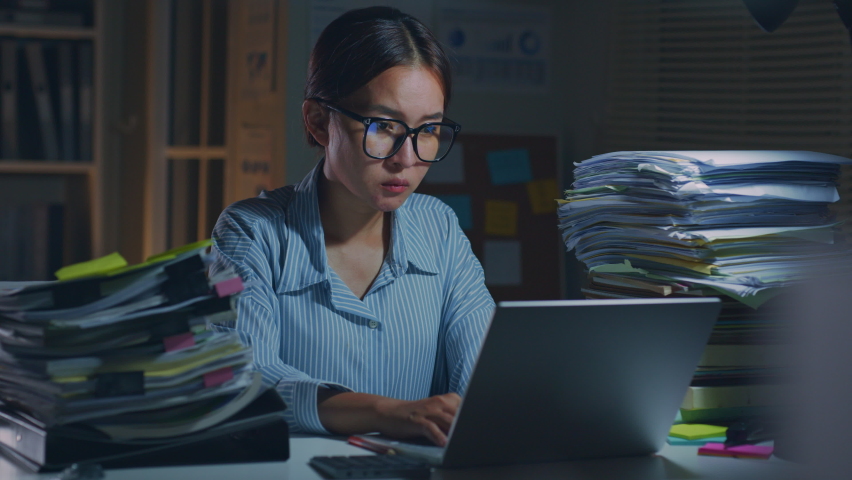 Young Asian office employee feeling tired, fatigue, exhausted while working overtime at night in office Royalty-Free Stock Footage #1091524775