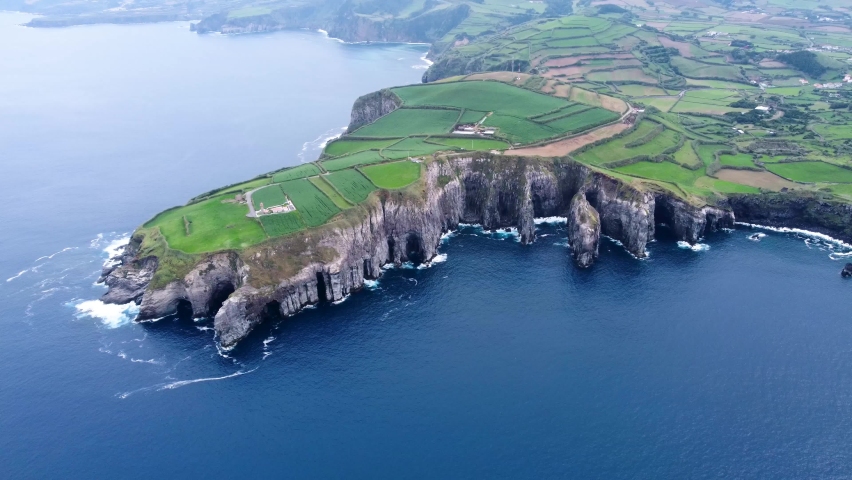 Panoramic view of cliff coastline in Azores island. Top aerial view Sao Miguel drone footage high quality 4k Royalty-Free Stock Footage #1091527575