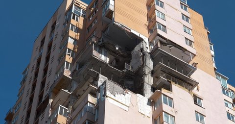 After bombing, russian missile damaged high-rise apartment building in Kiev city. War in Ukraine. Russian aggression. Terror and genocide of Ukrainian people