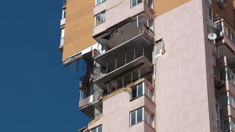 After bombing, russian missile damaged high-rise apartment building in Kiev city. War in Ukraine. Terror and genocide of Ukrainian people