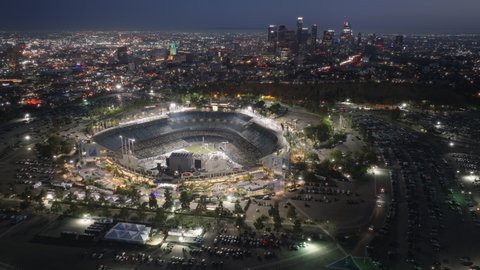 Dodgers Sport Stadium in Los Angeles, California, West Coast, United States of America, June 2022. Illuminated Dodgers sport Stadium at night, baseball stadium from height 4K footage of music concert