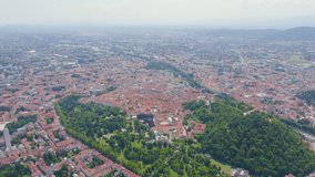 Inscription on video. Graz, Austria. The historic city center aerial view. Mount Schlossberg (Castle Hill). Name is burning, Aerial View