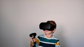Portrait of kid VR gamer. Child in vr gadgets set, helmet and goggles. Little boy in virtual reality.