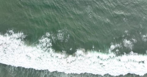 Waters of the ocean, swirl on the beach and scenic coastline. 4K Aerial view top view drone move Beautiful topical beach. Top view beach.