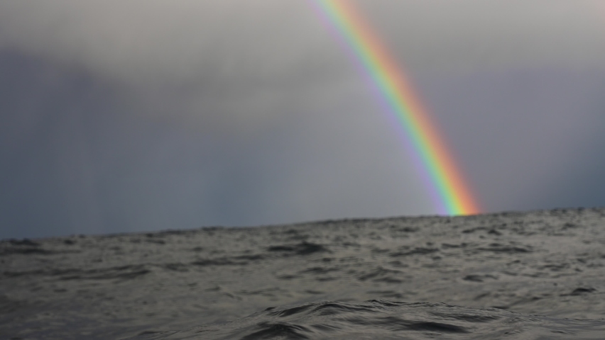 Beautiful Rainbow Amongst Stormy Clouds from the Ocean