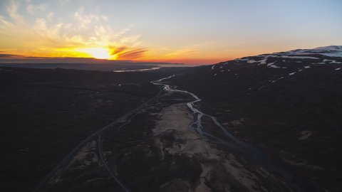 Establishing Aerial View Shot of magical sunset over lake river, Iceland
