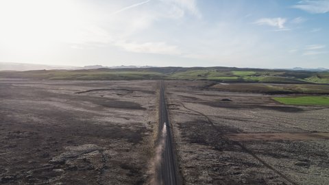 Aerial View Shot of following car on dusty road, Iceland