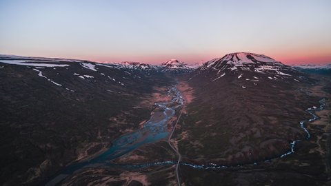 Aerial View Shot of red mountain tops at sunset, Iceland, Fjardabyggd, East 