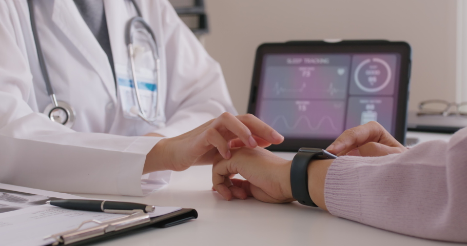 Close-up GP advice AI smart IoT watch guide to patient help collect ECG data, pulse heart rate, blood pressure, wrist sensor sport solution record connect to clinic health device digital platform app.