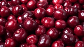 Fresh red Cherry rotate, closeup 4K video. Many juicy ripe berries Cherrys