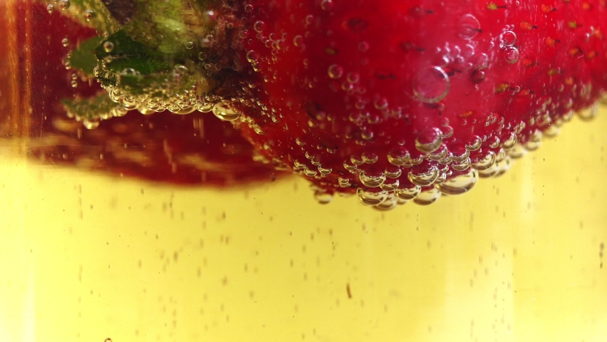 Champagne bubbles on strawberries close-up | Shutterstock HD Video #1091568045
