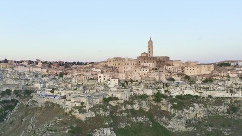 View from above, stunning aerial view of the Matera’s skyline during a beautiful sunrise. Matera is a city on a rocky outcrop in the region of Basilicata, in southern Italy.