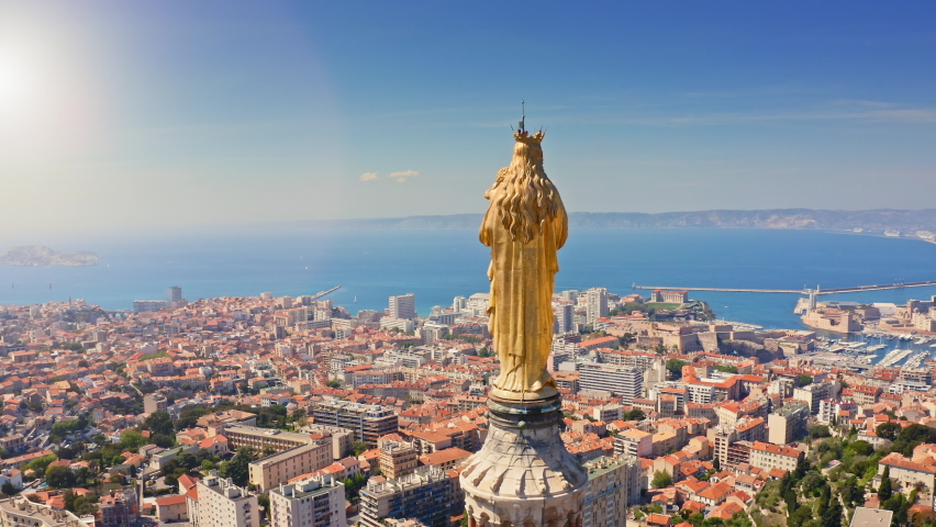 Marseille french port town in south France on Mediterranean sea coastline bay landscape beautiful sunny day panorama of Europe with basilica Notre-Dame de la Garde aerial touristic journey from drone Royalty-Free Stock Footage #1091573161