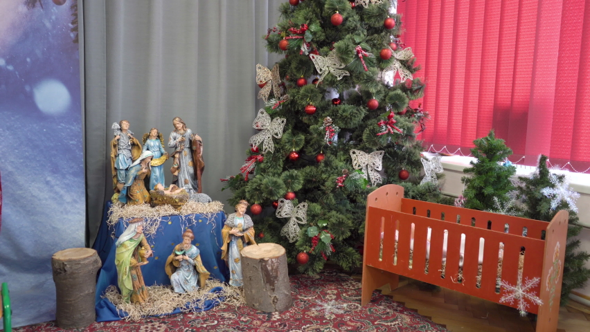 Christmas room,decorated room for the Christmas holidays with a Christmas tree and figures of the nativity scene | Shutterstock HD Video #1091574513