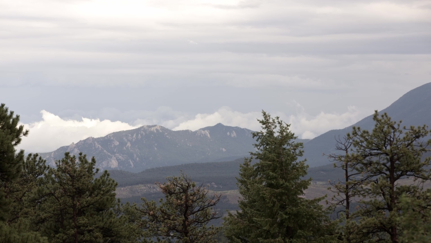 Cloudy weather time lapse of clouds building over the mountains of the Pike National Forest, Rocky Mountains, Colorado.