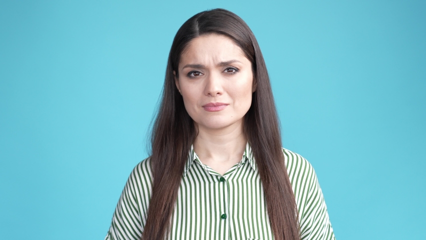 Hispanic professional boss speechless from bad news from coworkers