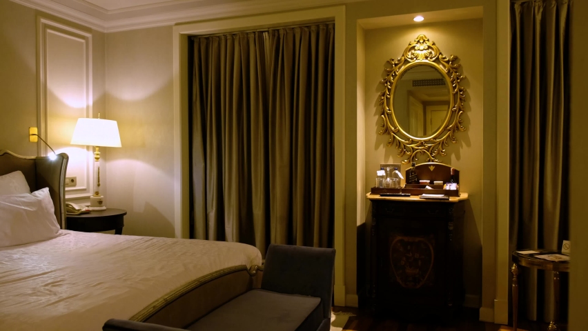 A luxurious hotel room with dim lights.