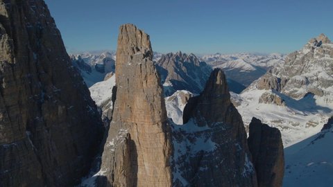 Slow push in towards Tre Cime South Tyrol extreme sunlit stone peaks mountain rock formation