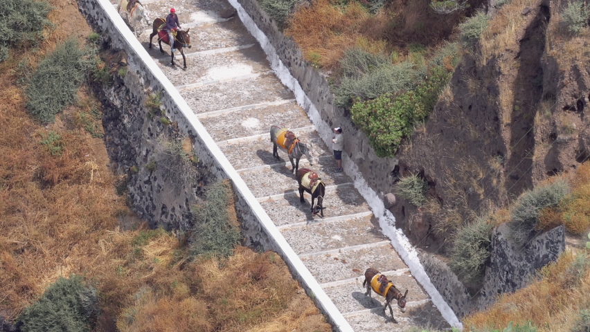 Santorini donkey road. Aerial view of te old road to the port in Santorini used as tourist attraction to travel riding a donkey