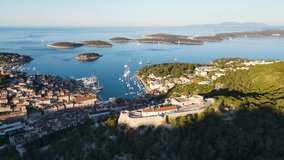 Aerial view of Spanish fortress and old town of Hvar in harbor of Adriatic sea on island Hvar. drone 4k video. Summer vacation destination